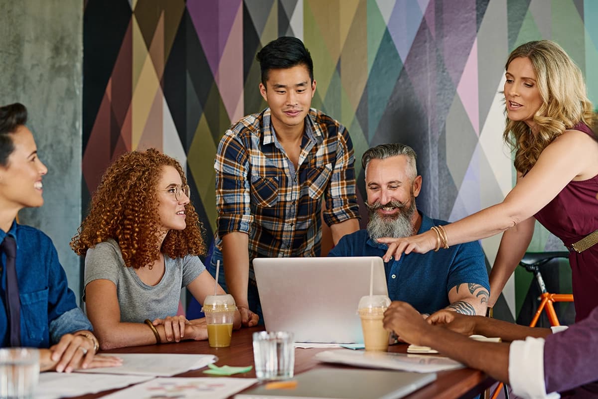 Marketing team collaborating with AI specialists on content strategy