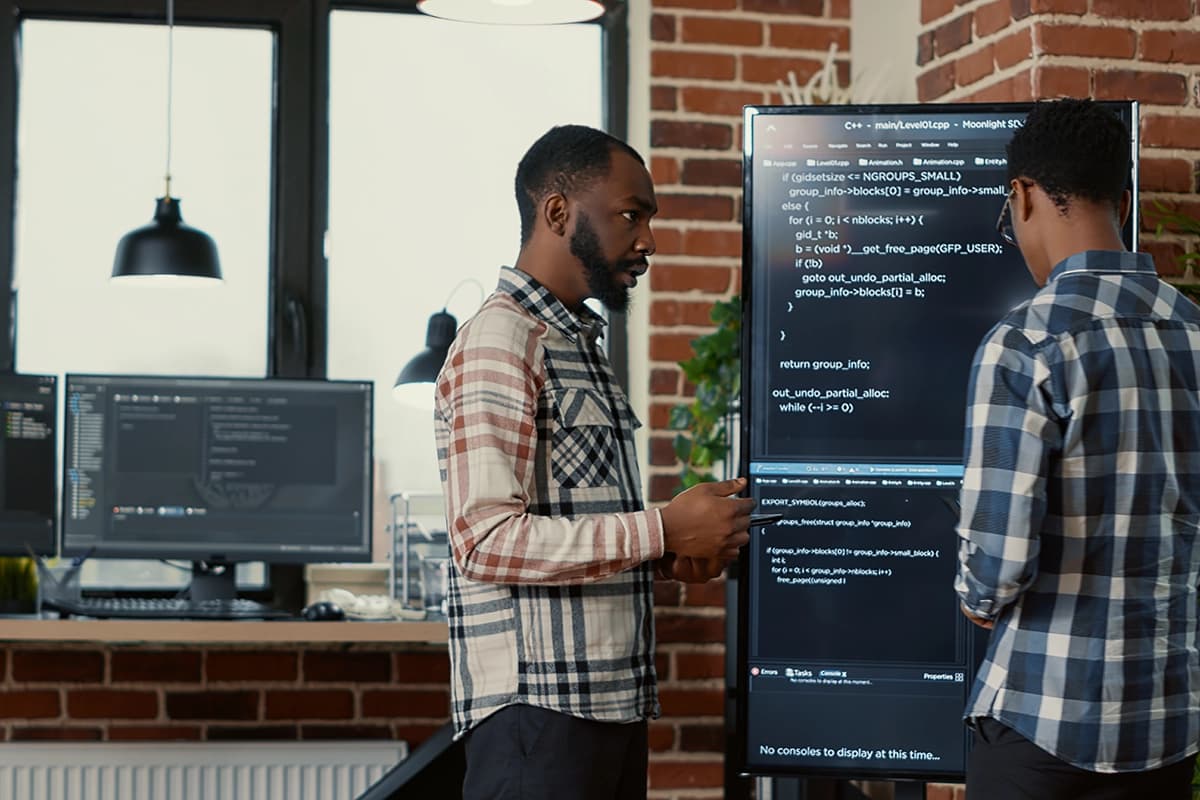 Team of software programmers leaving after analyzing output