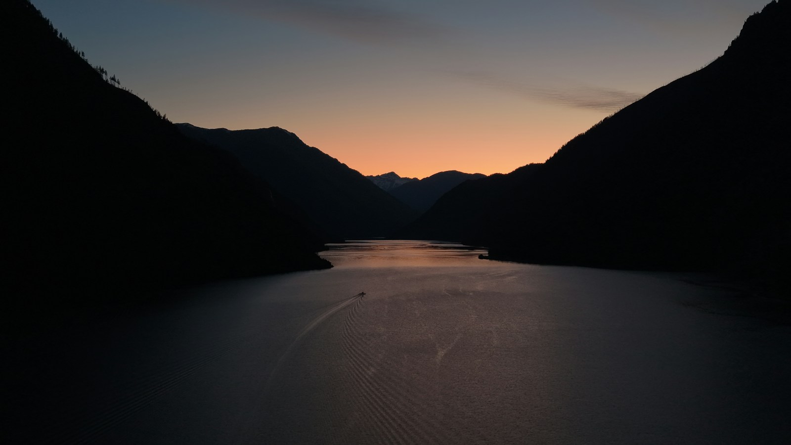 Mountain silhouettes framing Seton Lake in British Columbia at dusk
